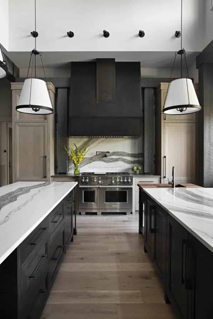 Black and white kitchen featuring wide plank hardwood flooring by Textures Nashville.