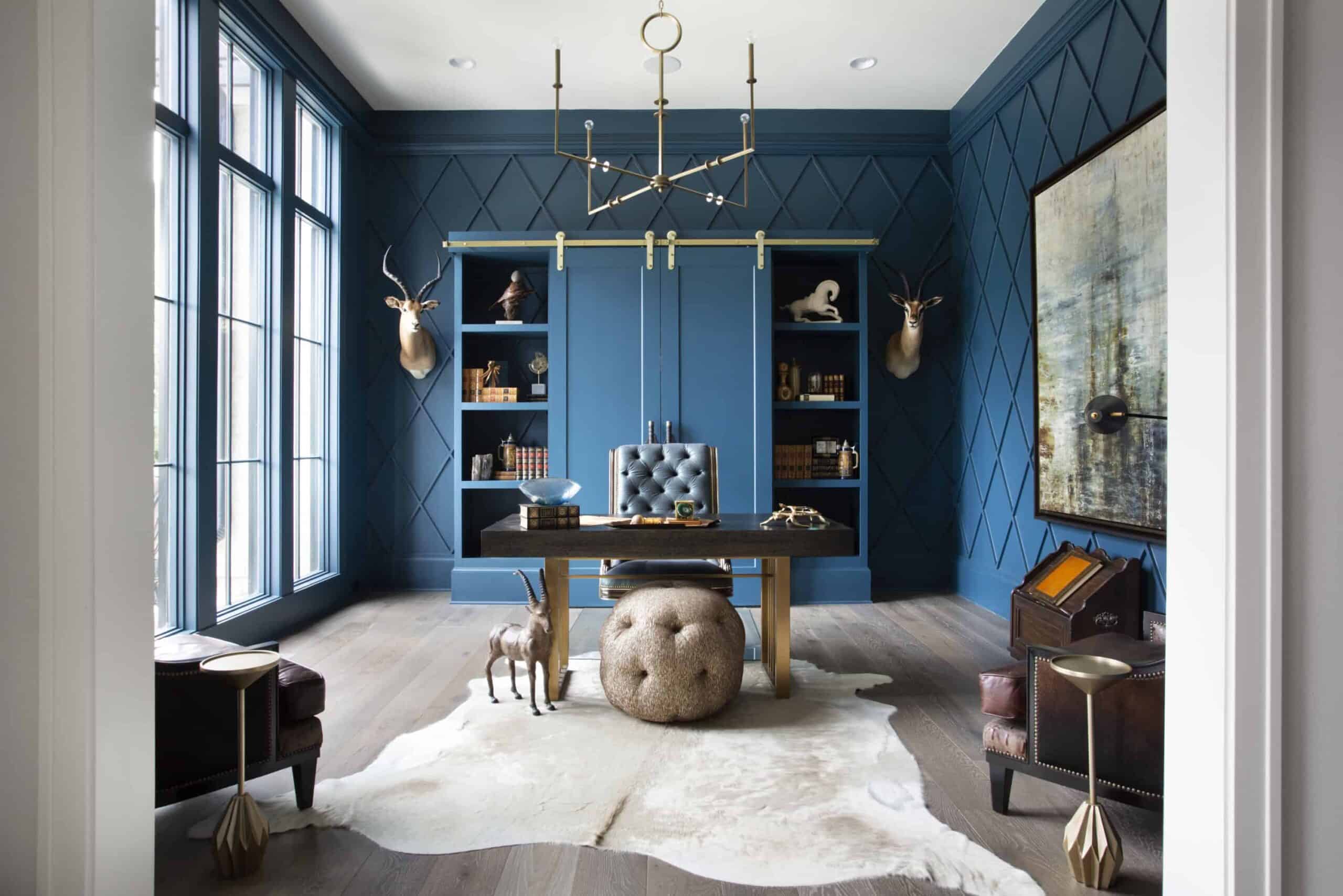 Luxe home office featuring 7" wide plan european oak flooring and bold blue walls and trim