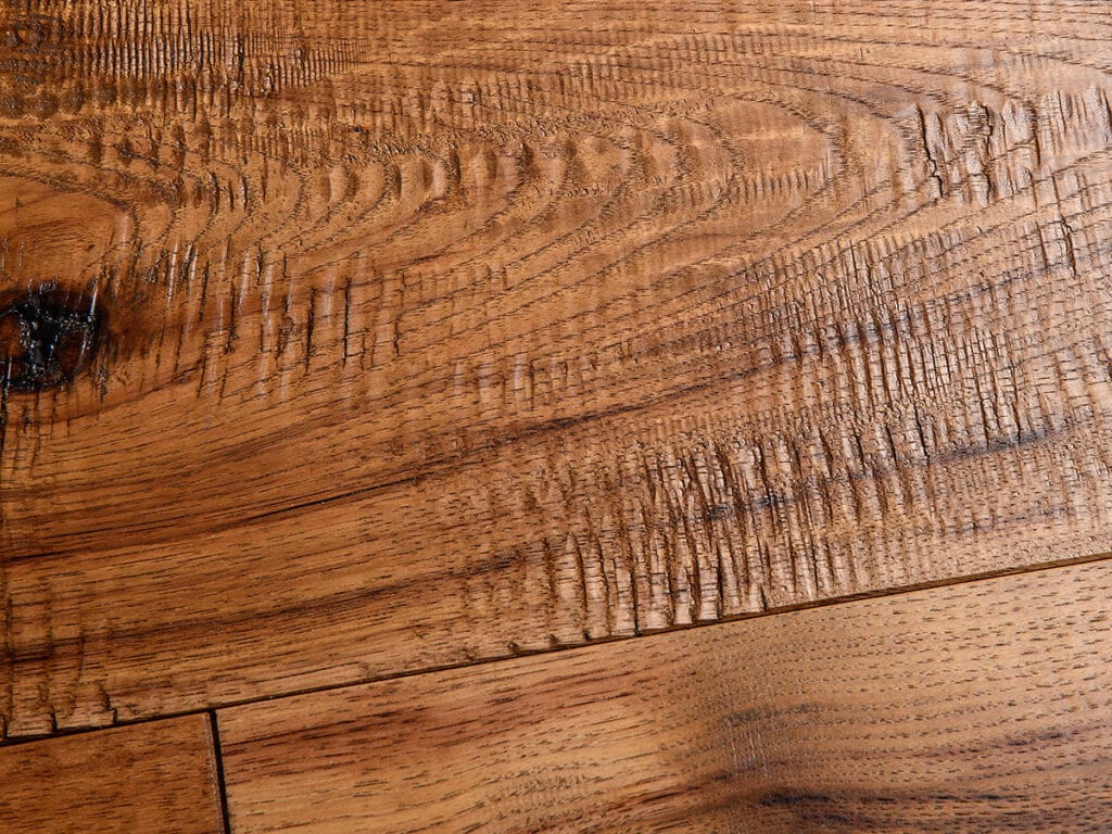 This is a close-up image of a wooden surface with distinct grain patterns, knots, and a textured rustic appearance, showing natural wood color variations from the Textures Curated line by Textures Nashville.